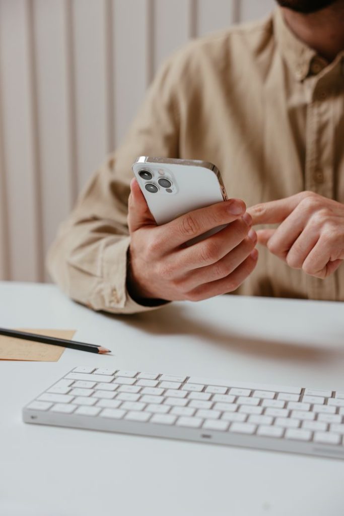 a-person-using-his-smartphone-7657615-YNTbKH3LJl1c3QsVsPGV